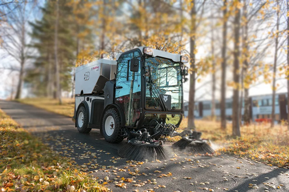 Multihog CV sweeper clearing leaves